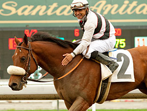 Mike Smith and Amazombie celebrating after winning the Potrero Stakes.
