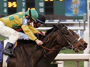 Bubbler with Eddie Martin, Jr. aboard (black cap-inside) gets a nose in front at the wire to win the Marie G. Krantz Memorial Handicap over Never Retreat with James Graham up at Fair Grounds Race Course in New Orleans, LA. 