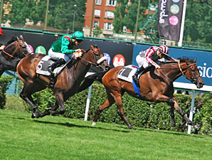 Sarafina, outside, and Cirrus Des Aigles, front, race in the Grand Prix de Saint Cloud.