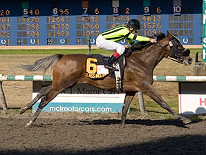Class Included wins the 2011 BC Oaks.