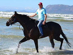 Ebony Flyer and trainer Justin Snaith at the beach in Cape Town.