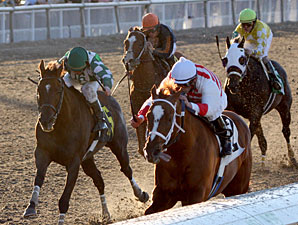Euroears with Jamie Theriot up pulls ahead of Tempo Five with James Graham aboard to win the Thanksgiving Day Handicap at Fair Grounds.