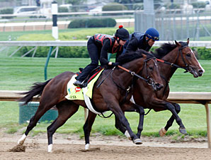 Orb works at Churchill Downs with Overwhelming on the inside.