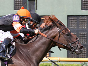 Skipping Town (orange cap) wins the 2011 LA Cup Distaff.