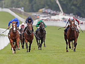 Toronado, outside in gray silks, wins the Sussex Stakes at Goodwood.