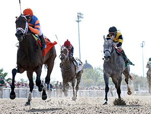 Unlimited Budget wins the 2013 Fair Grounds Oaks.